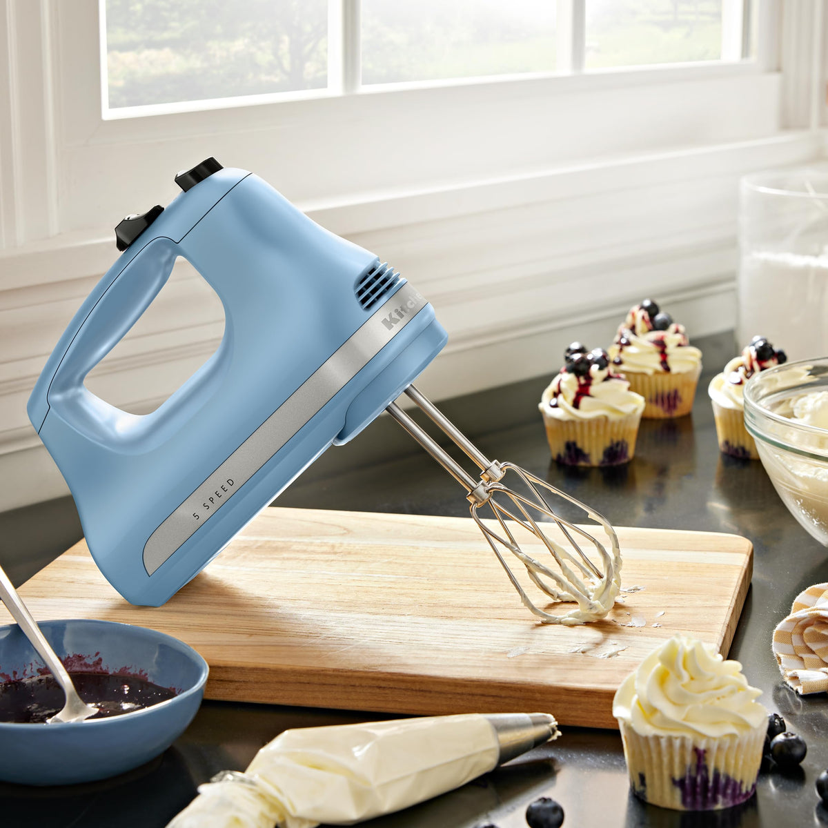 KitchenAid Velvet Blue hand mixer highlighting compact, lightweight design for everyday tasks.