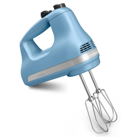 KitchenAid KHM512 Velvet Blue hand mixer with Turbo Beater accessories for smooth batter mixing.