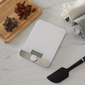 KitchenAid KQ908 tare function zeros containers between ingredients.