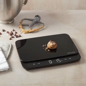KitchenAid KQ917 supports grams, ounces, pounds, fluid ounces, and milliliters.