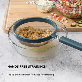 KitchenAid mesh strainer with ergonomic, weighted handle for comfort and control.
