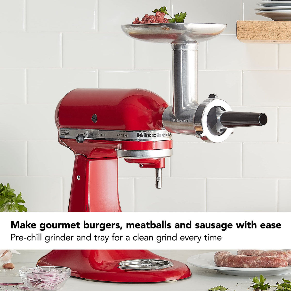 KitchenAid grinder in use processing meat for burgers and sausages at home.
