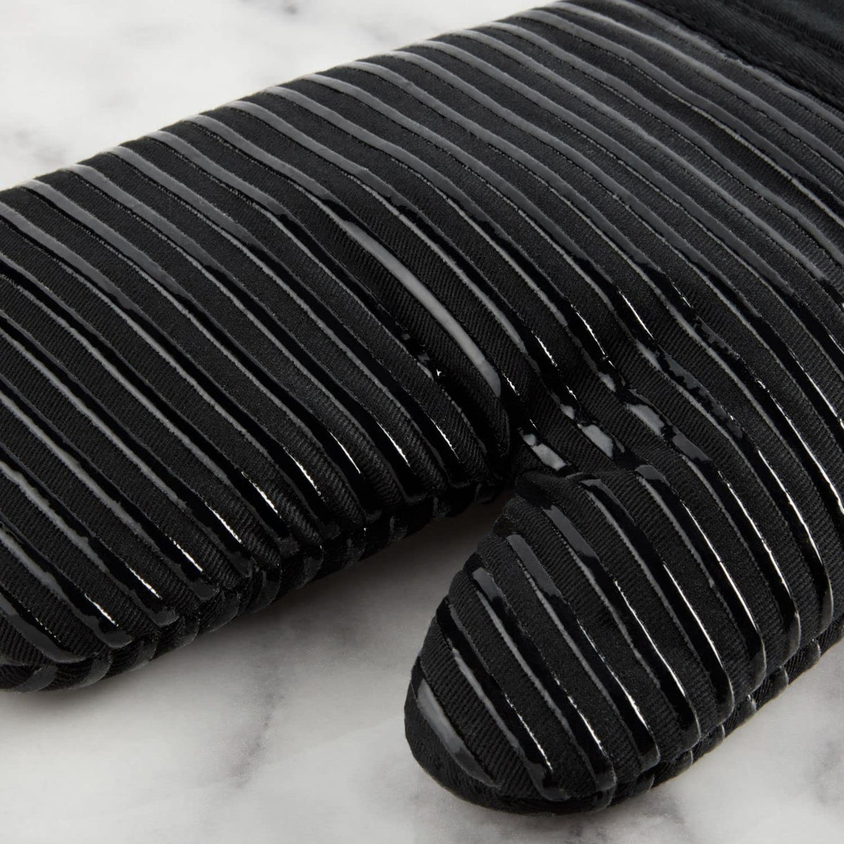 KitchenAid oven mitt details dual-layer quilted design for durable protection.