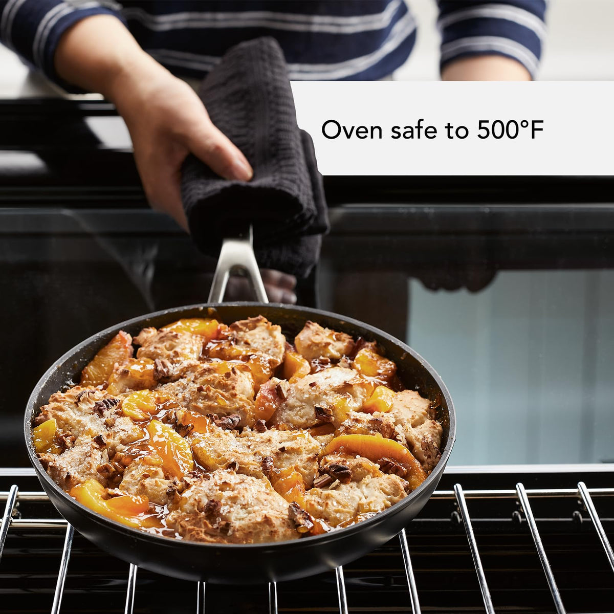 Tempered-glass lids on KitchenAid set for heat retention.