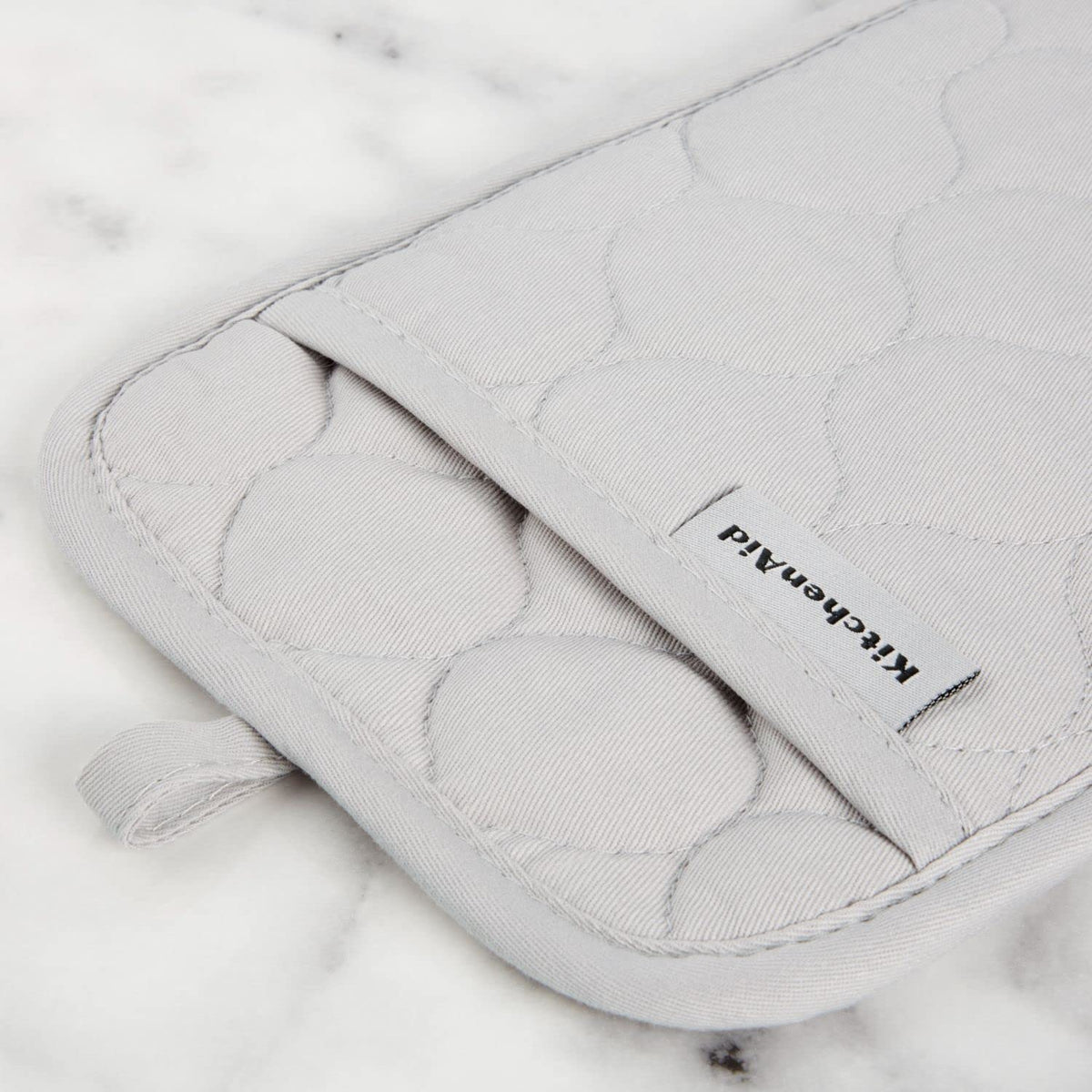KitchenAid Pot Holder closeup highlights reinforced quilting for durability.