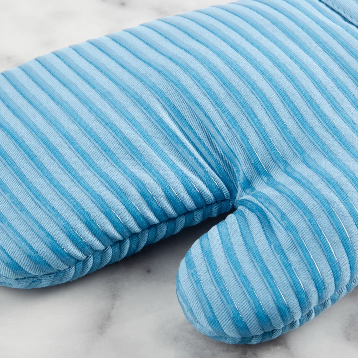 Close look at KitchenAid pot holder blue velvet texture and grip.