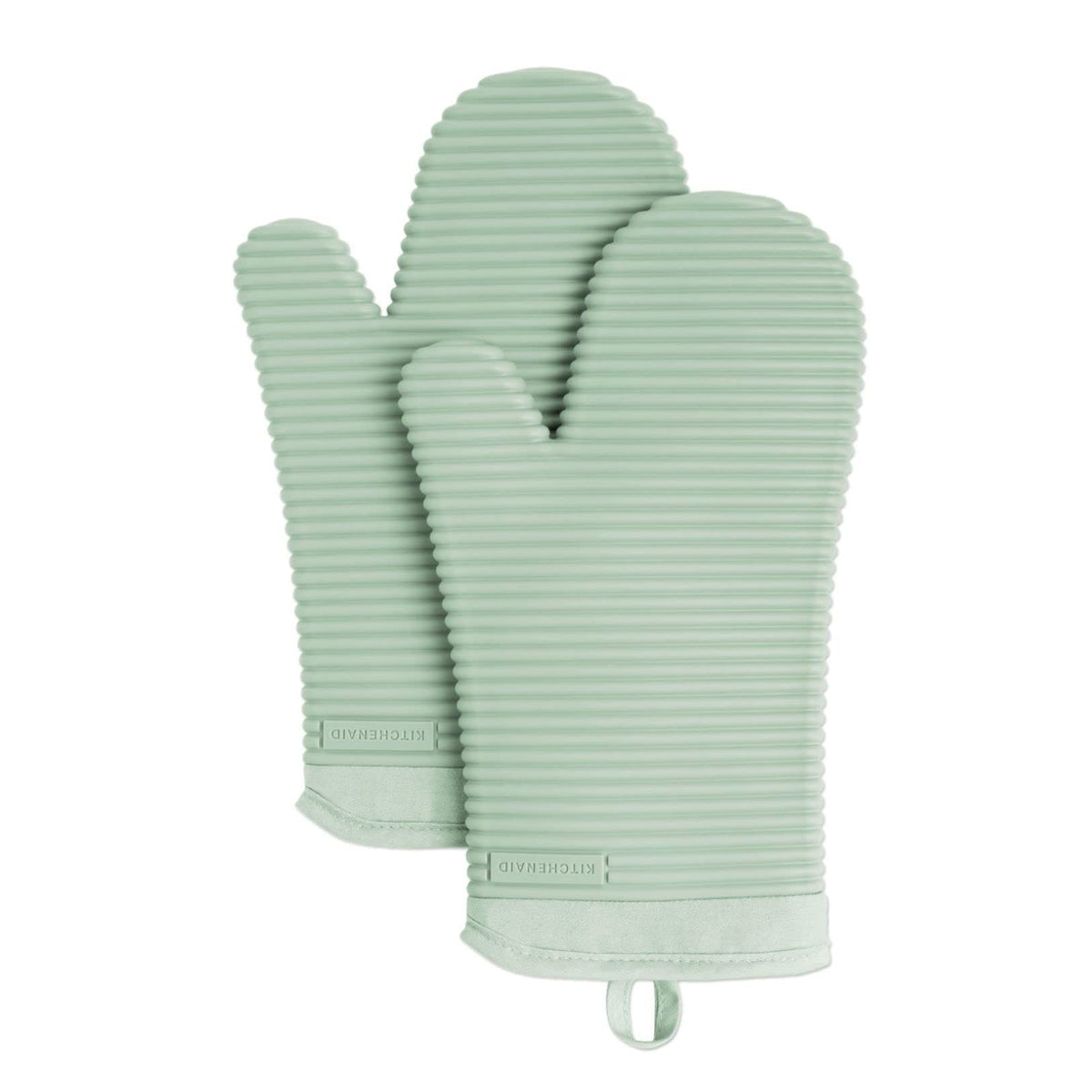 KitchenAid ribbed soft silicone oven mitts in pistachio provide a secure grip on hot pans.