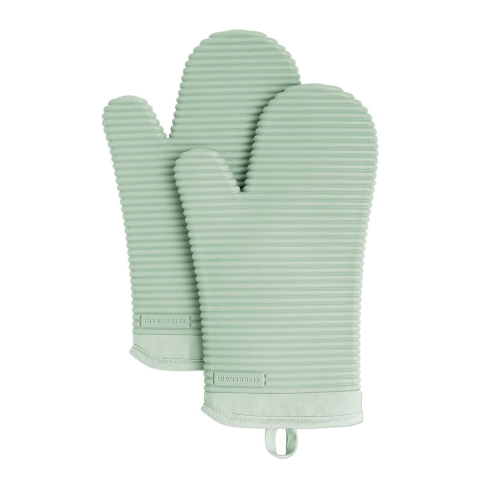 KitchenAid ribbed soft silicone oven mitts in pistachio provide a secure grip on hot pans.
