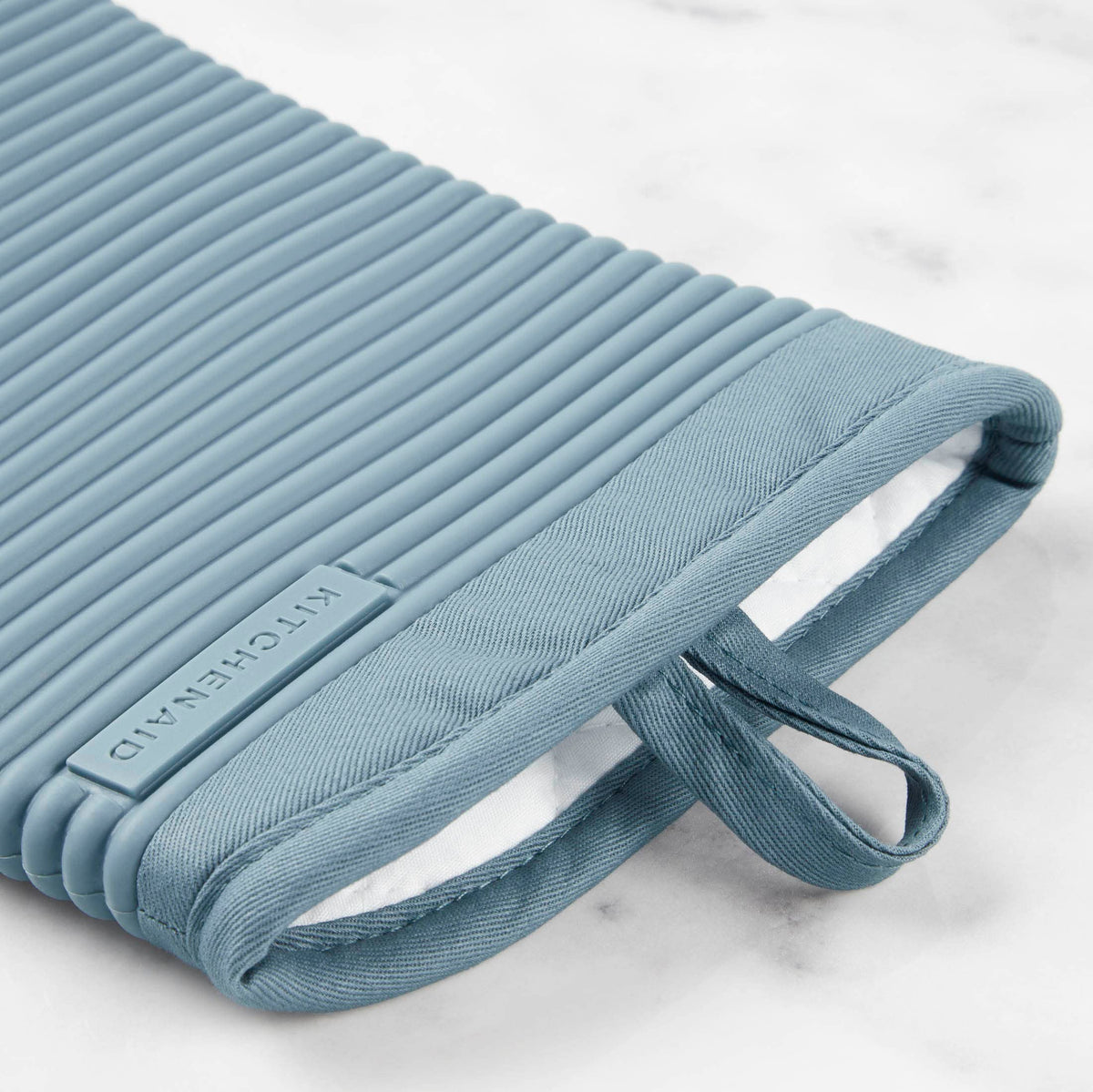 KitchenAid ribbed silicone oven mitts in fog blue color, waterproof design