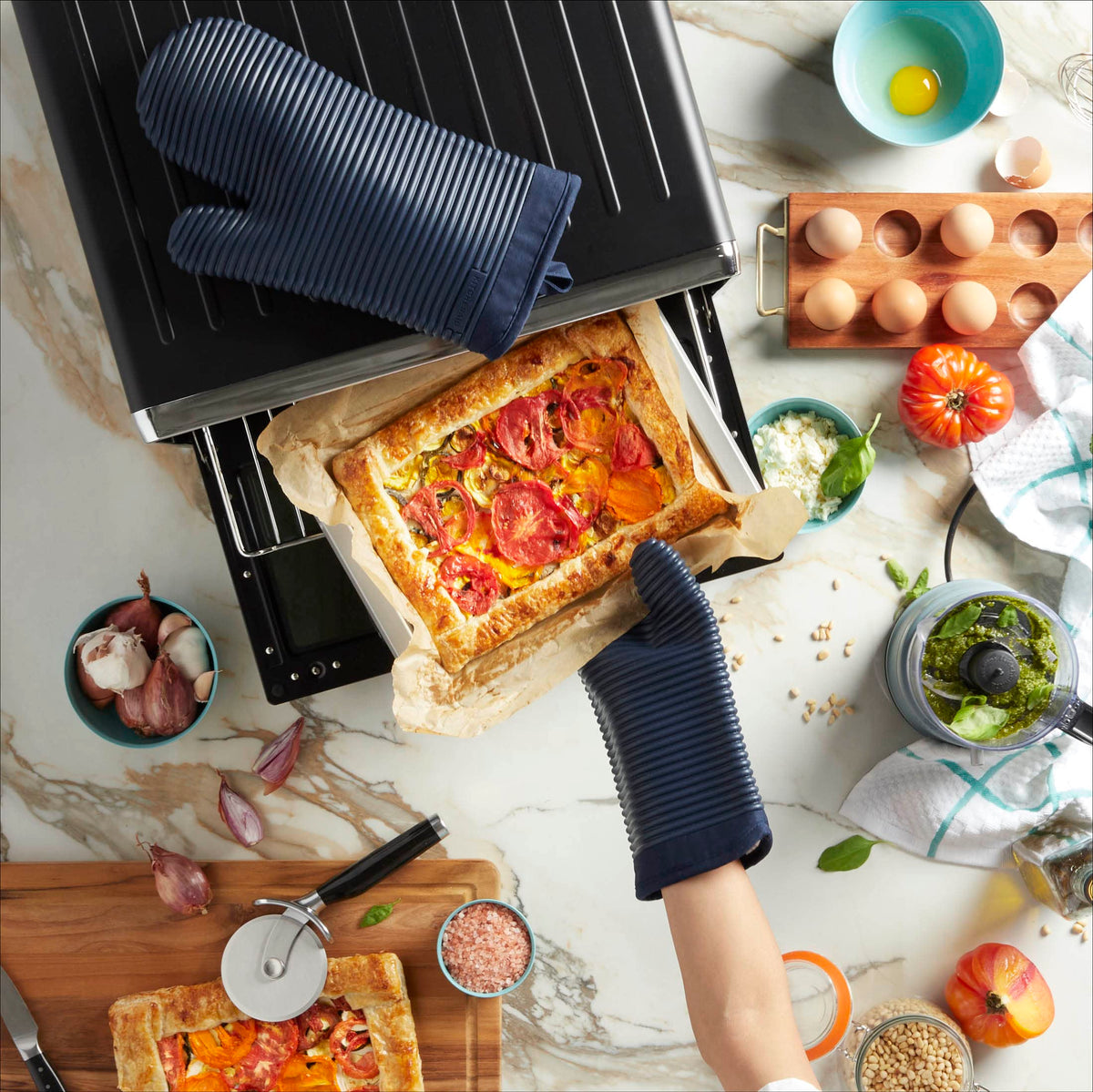 KitchenAid ribbed silicone mitts stay slip-resistant during hot pan handling.