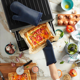 KitchenAid ribbed silicone mitts stay slip-resistant during hot pan handling.