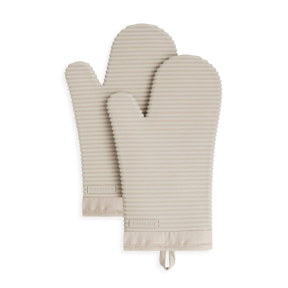 Kitchenaid ribbed soft silicone oven mitts in milkshake color with secure grip for hot pans.