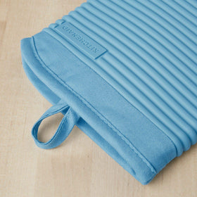 KitchenAid ribbed silicone texture close-up highlighting grip and water resistance.