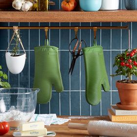 Matcha KitchenAid oven mitts feature a cotton cuff for added heat protection and comfort.