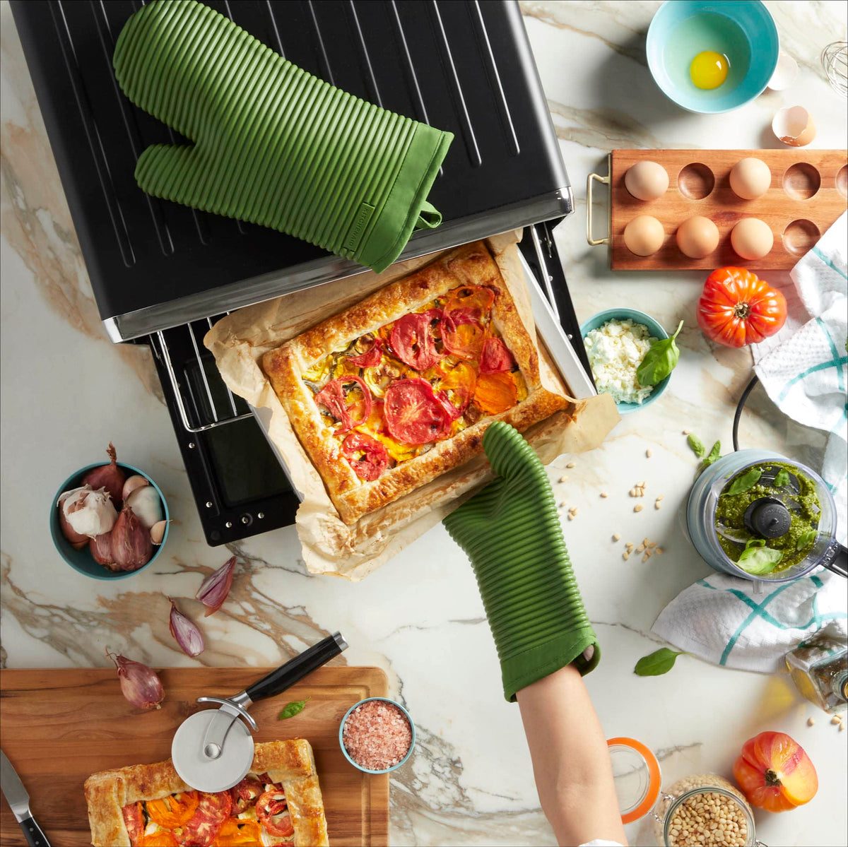 Close-up of ribbed texture on KitchenAid silicone mitts enhances grip and spill resistance.