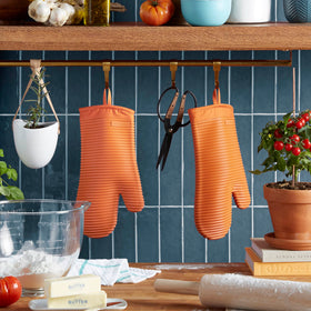 KitchenAid ribbed silicone mitts showing textured grip on hot pans