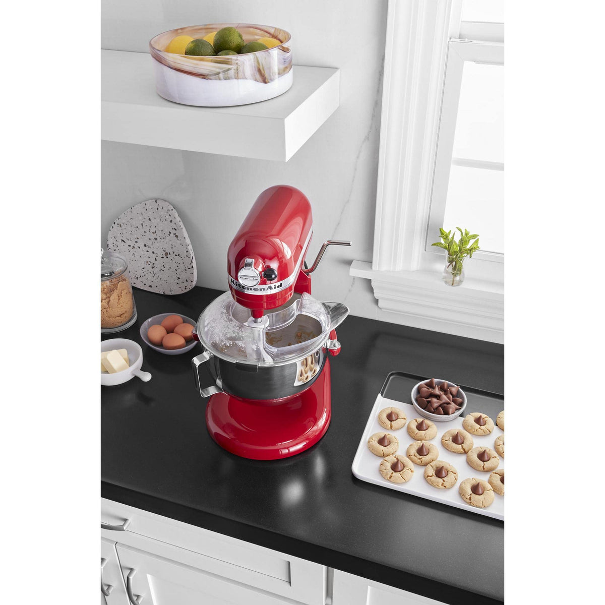 KitchenAid Secure Fit shield keeps ingredients in the bowl, reducing countertop cleanup