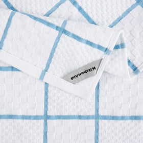 Close-up of silicone grip on KitchenAid oven mitt for secure handling.
