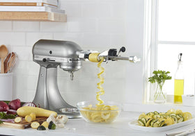 KitchenAid spiralizer produces apple slices for healthy snacks.