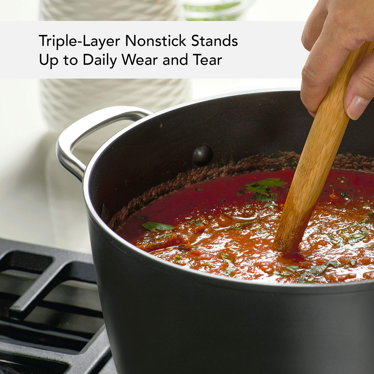 KitchenAid stockpot with reinforced handle rivets enhances durability and grip.
