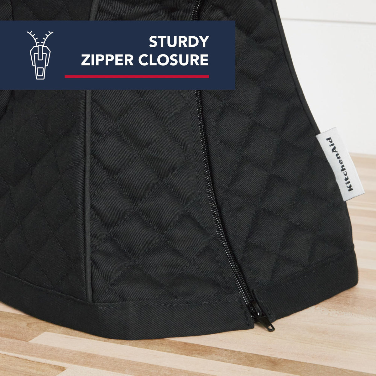 Zipper-back access on KitchenAid tilt-head mixer cover for easy cleanup.