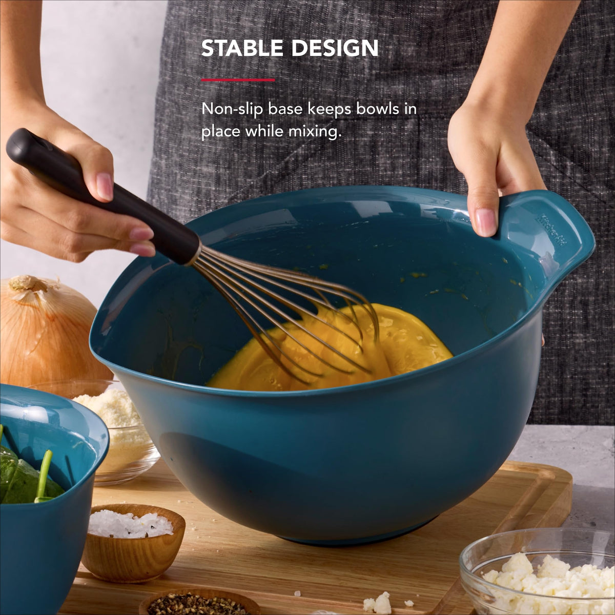 KitchenAid universal non-slip-base bowls pictured stabilizing during mixing.