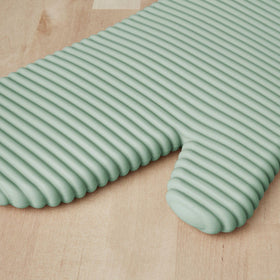KitchenAid waterproof silicone mitts with cotton cuffs shield wrists from heat.