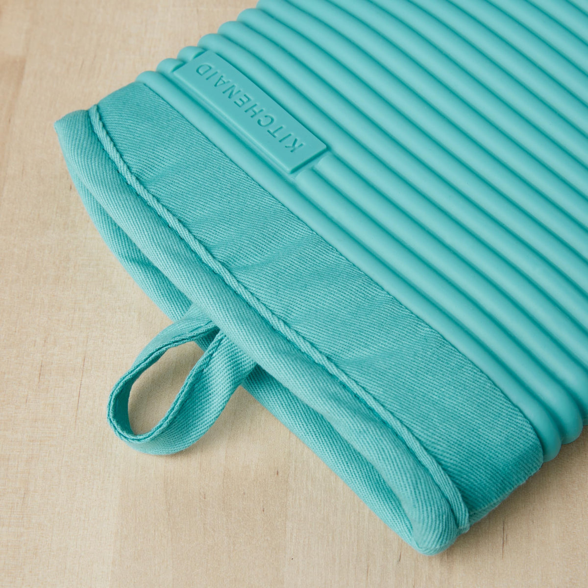 KitchenAid waterproof silicone oven mitt resisting spills during cooking