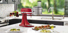 KitchenAid wide feed tube accepts larger ingredients, reducing prep steps.