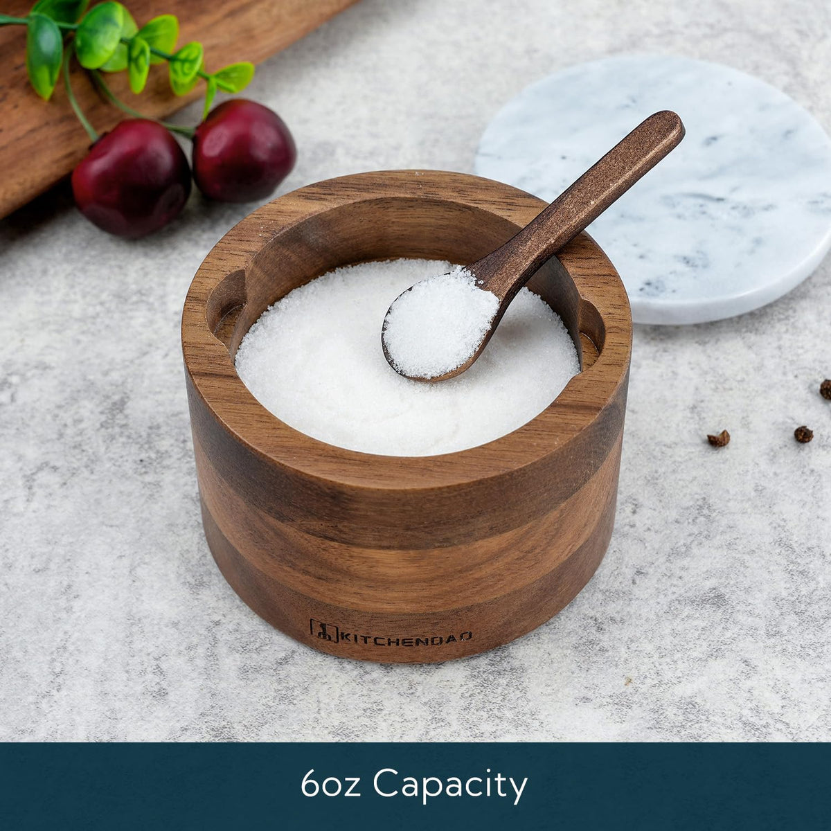 KITCHENDAO acacia salt cellar with built-in spoon for convenient scooping.