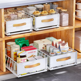 Kitstorack pull-out cabinet organizer in action, revealing easy access to back items.