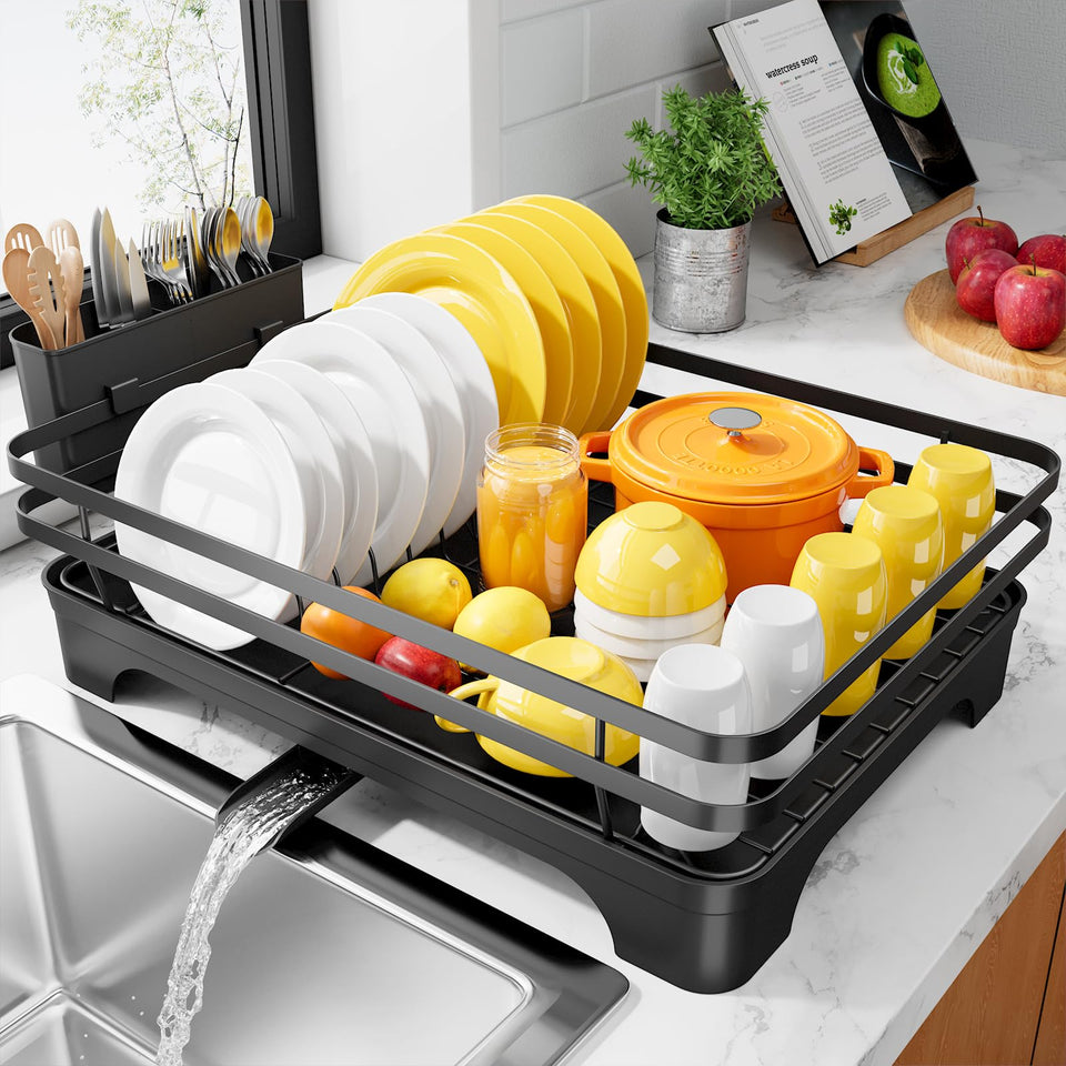 Kitsure dish drying rack with rotatable spout directing water away from dishes.