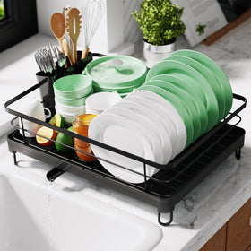 Kitsure dish rack on compact base organizes plates and bowls on a sleek black countertop.