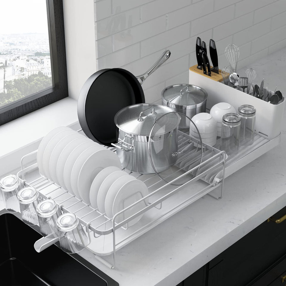 Kitsure extendable dish drying rack expanded on a kitchen counter showing space-saving design