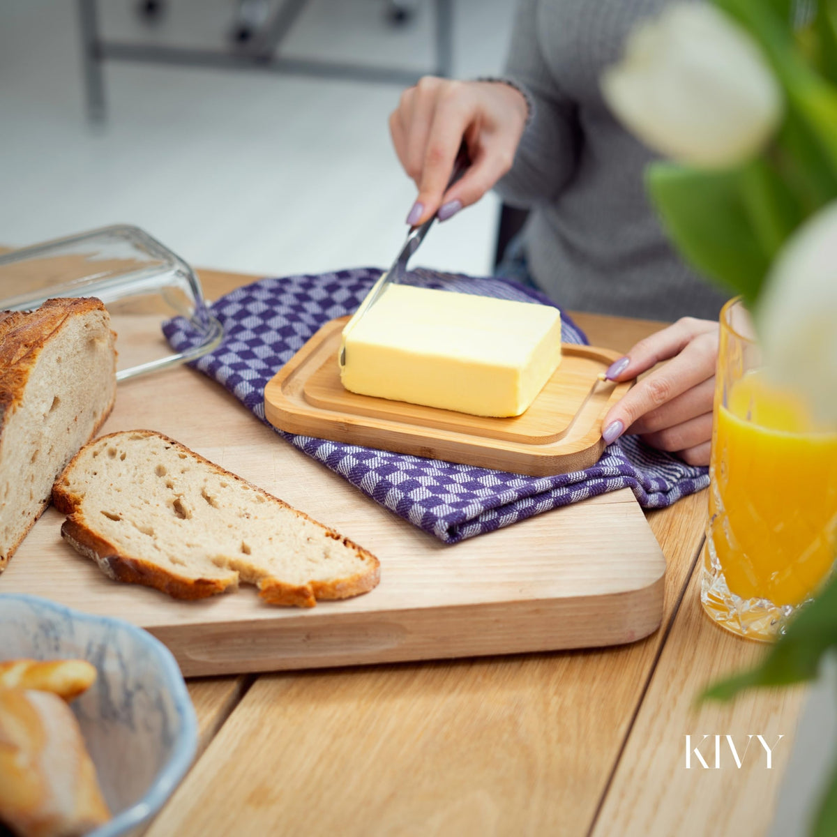 KIVY butter sticks stay in place on the wooden plate.