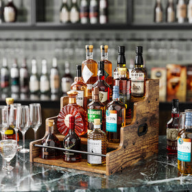 KLM liquor display shelf side view highlights compact countertop footprint.