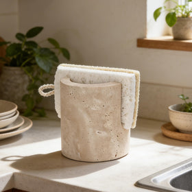 KLYROVA travertine sponge holder with natural veins for stylish counter display.