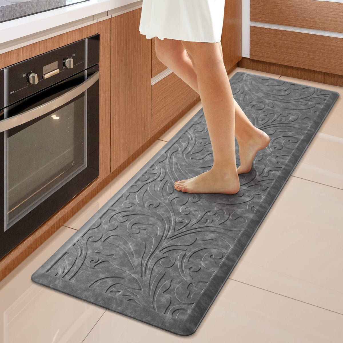 KMAT Kitchen Mat anti-fatigue foam core supports comfortable standing during cooking tasks.