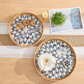 Kmelep round rattan tray on wooden base ideal for fruit and bread.