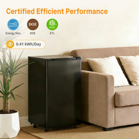 KMFurnila mini-fridge in a bedroom setup for easy access to beverages
