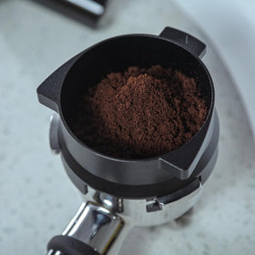 KNODOS 54mm dosing funnel twist-lock demonstrates secure Breville attachment