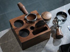 KNODOS walnut tamping station features removable silicone pads for stability