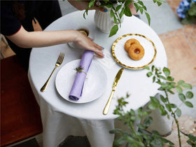 KOFFOTA lavender napkins offer soft, absorbent surface for everyday meals.