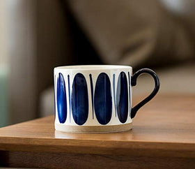 Koja durable porcelain mug stack illustrating long-lasting quality