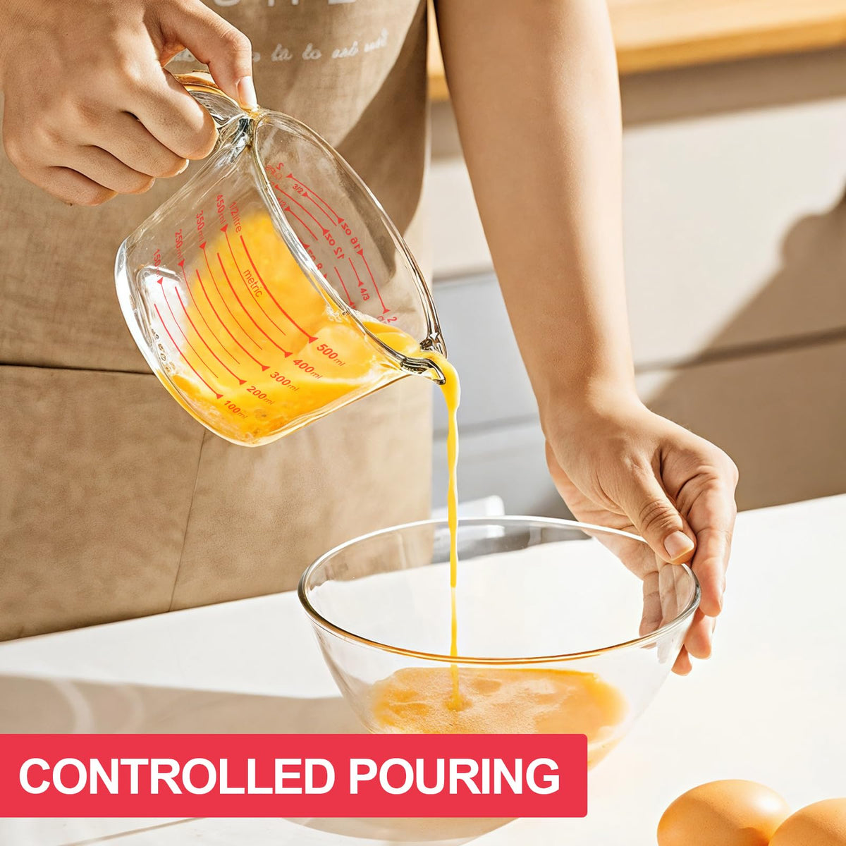 Komuee glass measuring cup with pour spout for smooth transfers.
