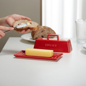 Kook butter keeper on countertop for quick spreading and easy access.