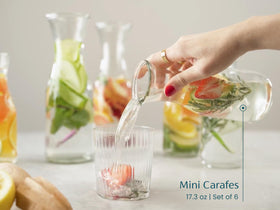 KooK clear glass carafe on table for beverages and presentation.