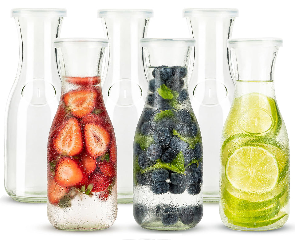 KooK glass carafe set of six on table for wines and juices.