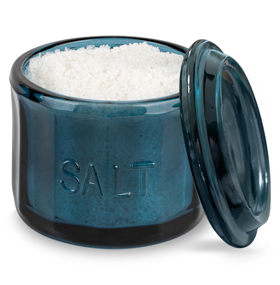 KooK glass salt cellar with navy blue lid keeps salt within reach on the counter.