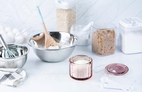 Pink lid fits snugly on a glass salt cellar for dry, fresh contents